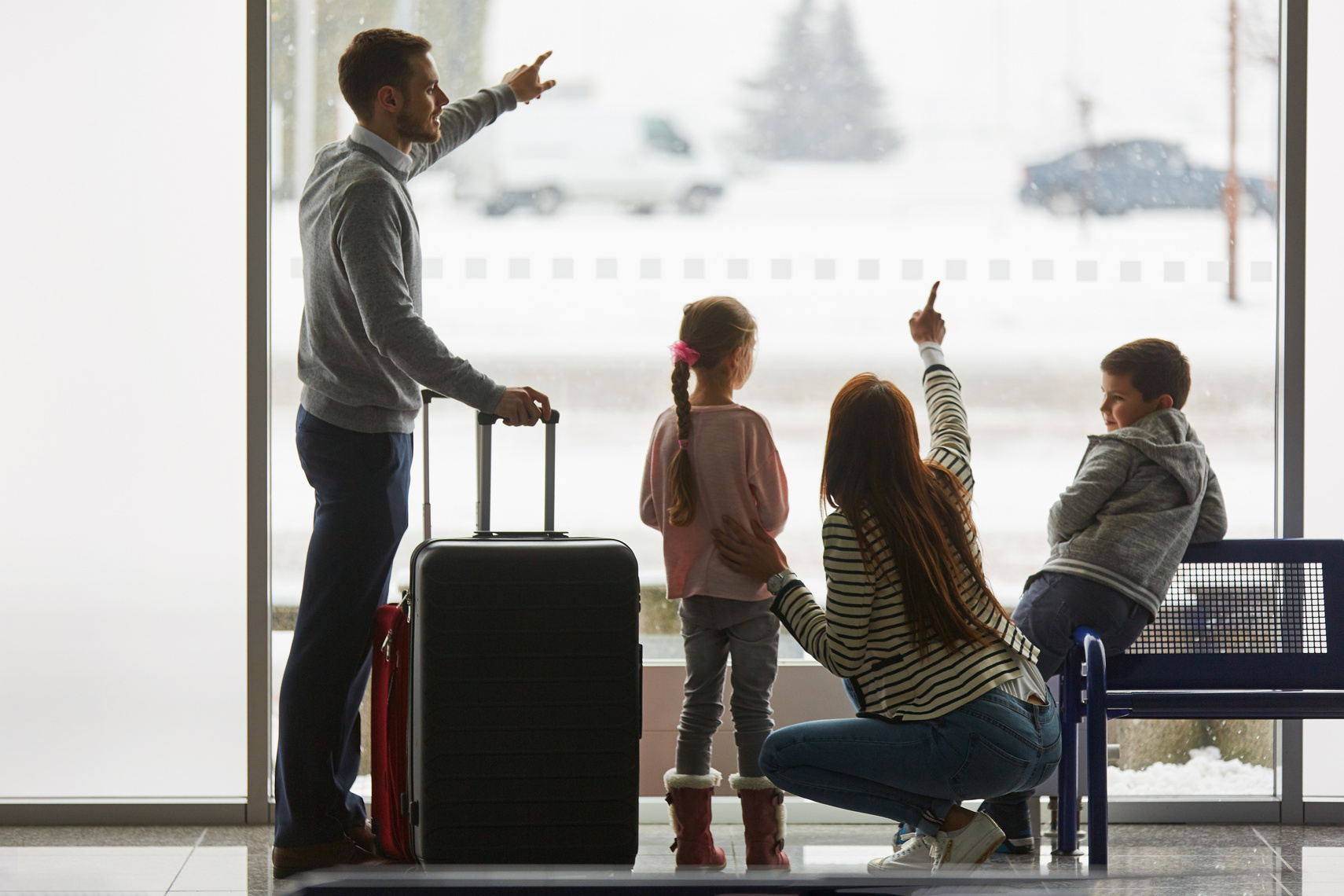 Family and Children in the Airport Watch Planes